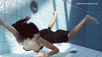 Submerged Seduction: Russian Brunette's Underwater Tease