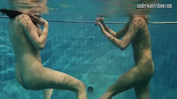 Dive into Naked Bliss: Stunning Girls Swim Underwater