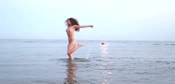 Teen (18+) Beauty Unleashes Sensual Beachside Temptation