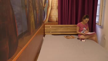 Alice's Casual Charm: Bored Brunette in T-Shirt Teases with Tiny Tits