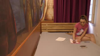 Alice's Casual Charm: Bored Brunette in T-Shirt Teases with Tiny Tits