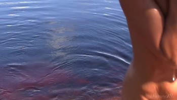 Lily's Sunny Seduction: A Natural Redhead Unfolds by the Water