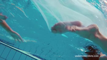 Blonde and Brunette Sirens Seduce in Underwater Shower Showdown