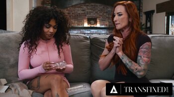 Transfixed by Desire: Redhead MILF Sophia Lockes Shares Cum Swap With Eva Maxim