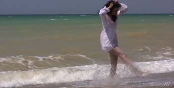 Dark-Haired Siren Xenobia Sizzles in Naked Beachside Seduction