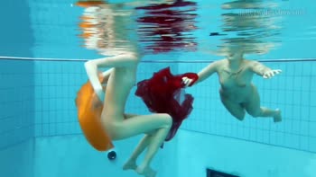 Submerged Seduction: Petite Lesbians Sizzle in Underwater Rendezvous