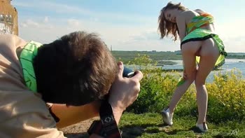 Blonde Bombshell Struts Outdoors in Mini Skirt Exposing Her Stunning Big Tits