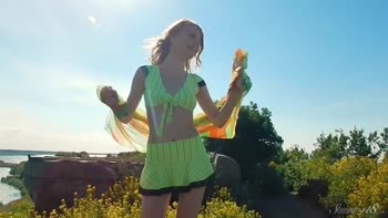 Blonde Bombshell Struts Outdoors in Mini Skirt Exposing Her Stunning Big Tits