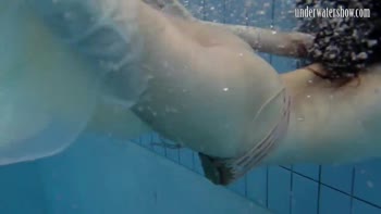 Andrea's Underwater Delight: A Teenage Brunette's Splashy Solo