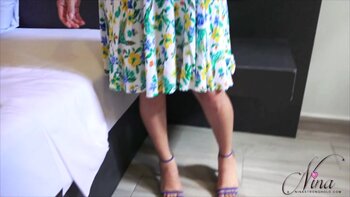 Nina StrongHold's Sizzling Striptease: Busting Out of Her Sexy Sundress