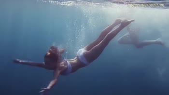 Blonde and Brunette Babes Take the Underwater Plunge