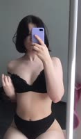 The cutie squeezes her breasts.