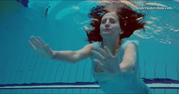 Petite Russian Babe's Submerged Strip Show