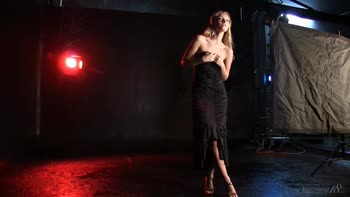 Blonde Beauty Struts in Seductive Black Dress