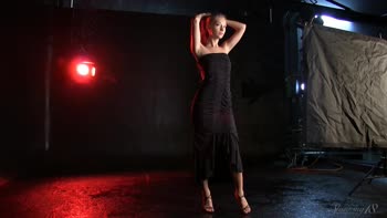 Blonde Beauty Struts in Seductive Black Dress