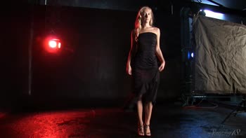 Blonde Beauty Struts in Seductive Black Dress