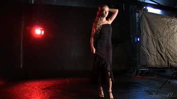 Blonde Beauty Struts in Seductive Black Dress