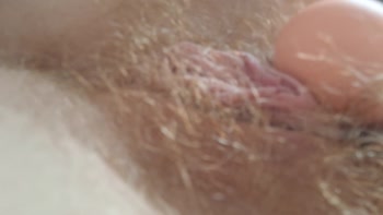 Ava Anson's Hairy Redhead Climaxes Multiple Times with Vibrator