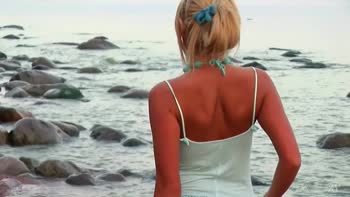 Sultry Blonde Stuns at Beach in Necklace and Nothing More