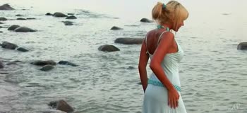 Sultry Blonde Stuns at Beach in Necklace and Nothing More