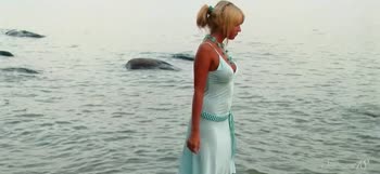 Sultry Blonde Stuns at Beach in Necklace and Nothing More