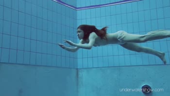 Sultry Redhead Bares All Under the Open Water