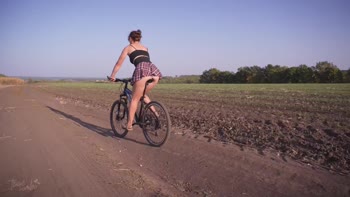 Teasecombo's Bike Ride Delight: Upskirt White Panties & Mini Skirts
