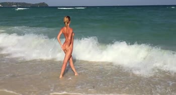 Stunning 18-Year-Old Blonde Bares Her Big Breasts at the Beach