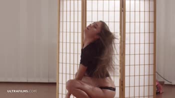 Lily Chey Sizzles in Seductive Solo Stripdown