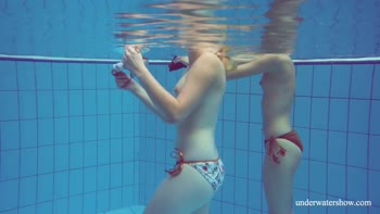 Melisa's Underwater Seduction with Blonde Babe Marusia