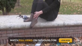 Beautiful blonde smoker showing her feet outdoors
